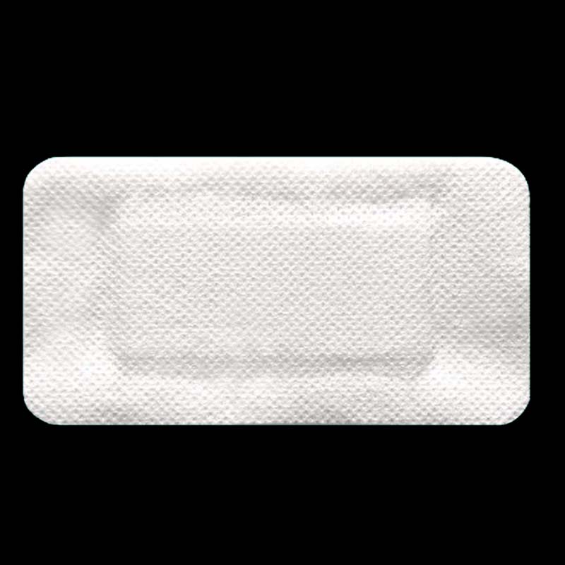 Adhesive non-woven wound dressing